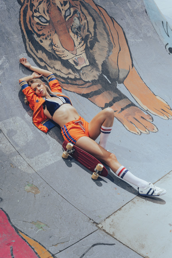 Soul Sister since 1969 orange retro bomber jacket on beauty blonde babe in skateboard bowl