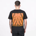 A person wearing a black crew neck t-shirt with an orange geometric pattern and a skull design on the back, along with the text 'HUNTERS ELEMENT' and 'UPF50+'.