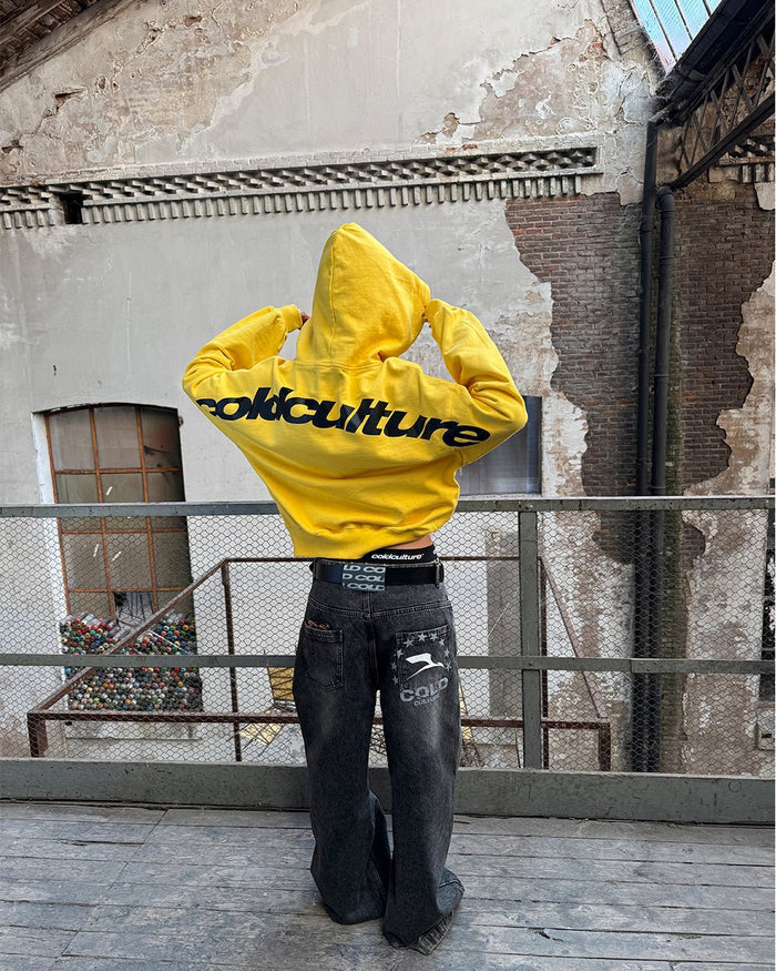CURVED HOODIE YELLOW - yellow logo print hoodie, street style shot - Cold Culture