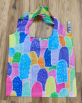 Colorful Aboriginal patterned shopping bag on a wooden surface