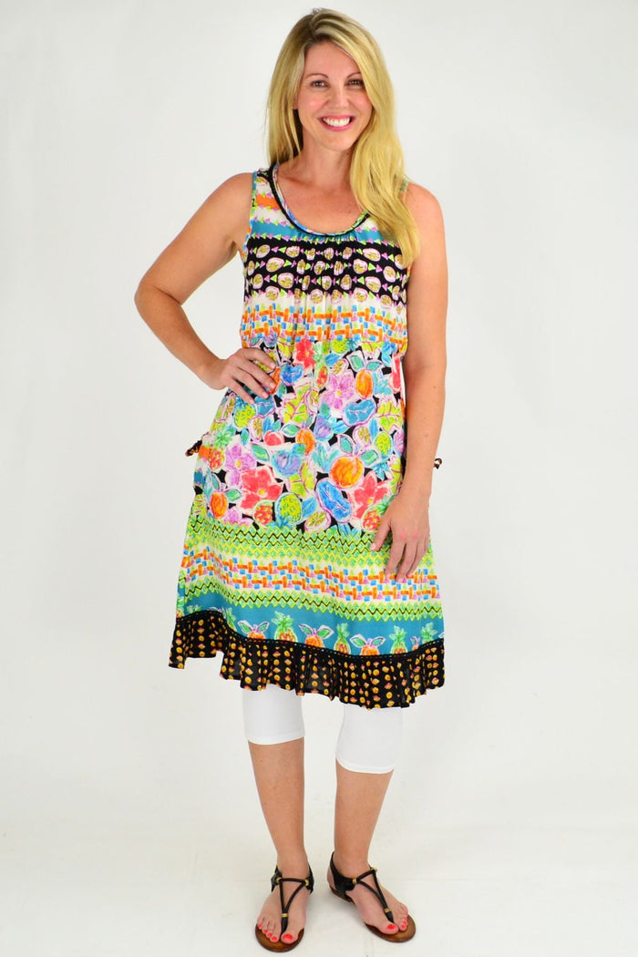 Orientique La Boqueria Tunic displayed on a hanger, featuring colorful, lightweight fabric with bohemian-inspired patterns.