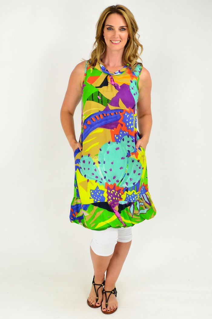 Orientique Palermo sleeveless tunic dress with a roll neck, featuring a flowy fabric and elegant design, shown on a model.