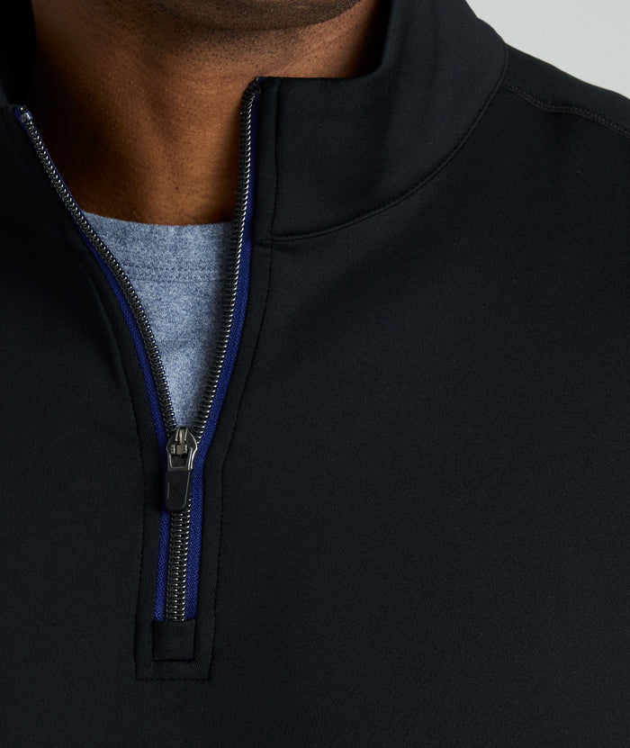 Model wearing a  Performance Quarter-Zip in black.