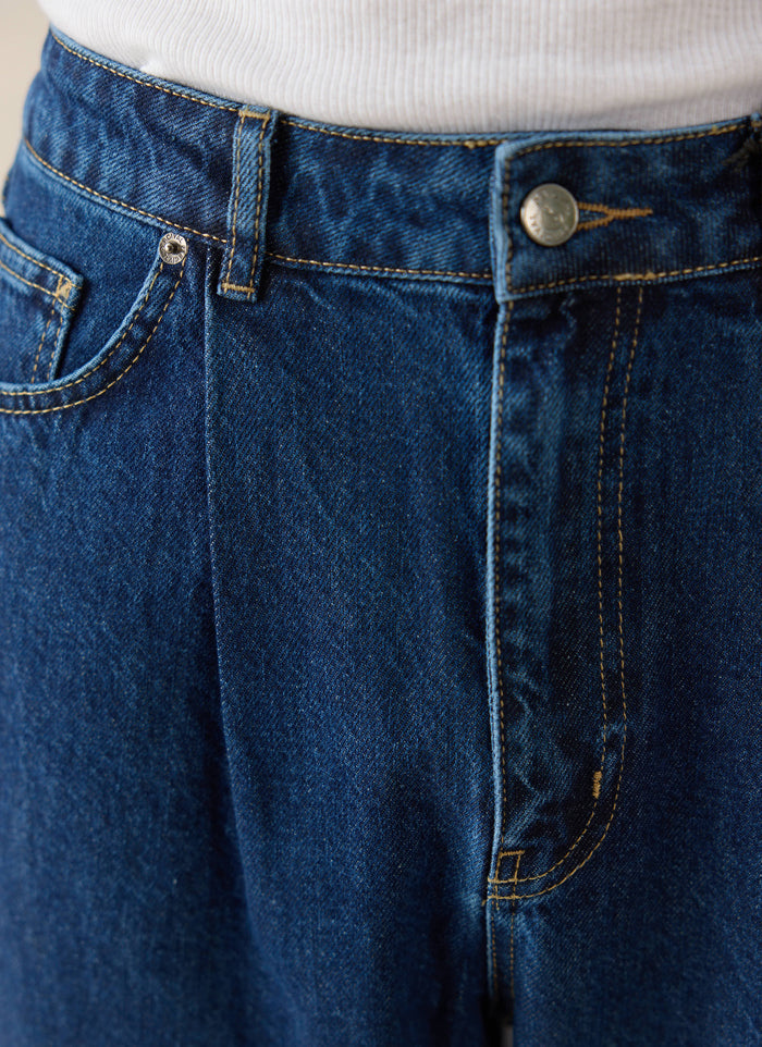 Percival Mid Wash Blue Pleated Denim Jeans in 12oz cotton, highlighting contrast stitching and the front pleat detail.