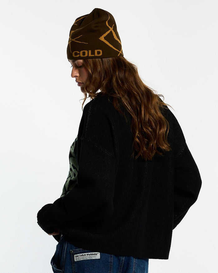 POISON KNIT BLACK AND GREEN - black graphic print knit sweater, back view on female model - Cold Culture #woman
