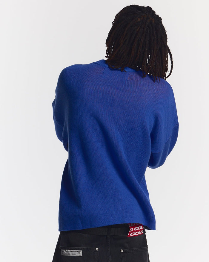 POISON KNIT BLUE AND ORANGE - blue graphic print knit sweater, back view on male model - Cold Culture #man