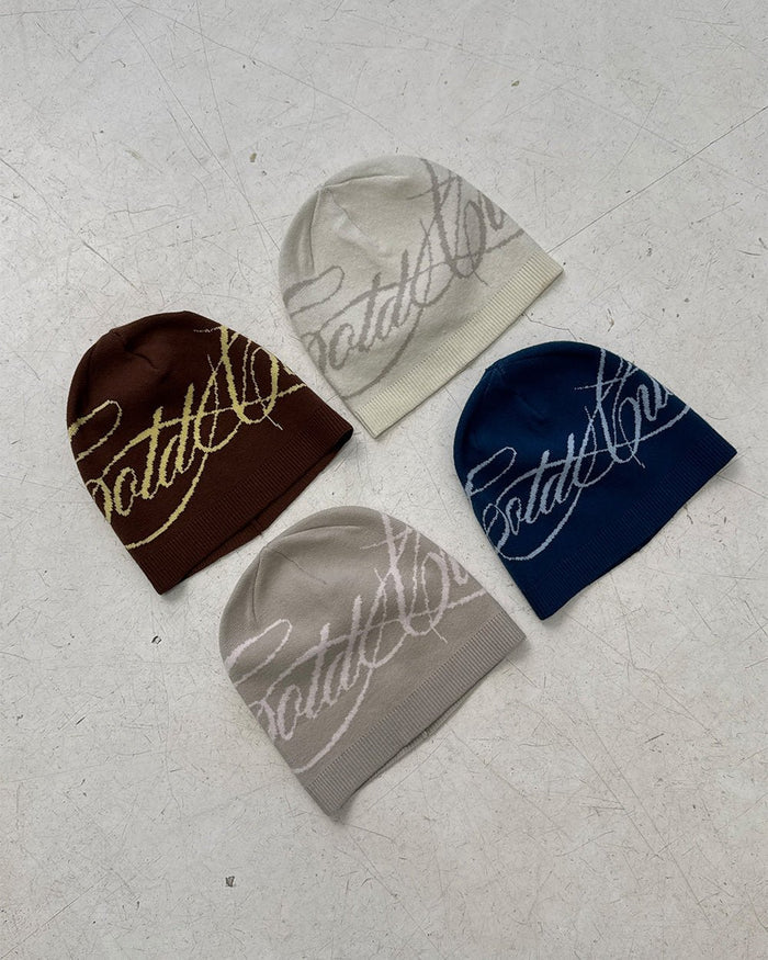 SCRIPT BEANIE BEIGE - beige script knit beanie, flat lay with matching pieces - Cold Culture
