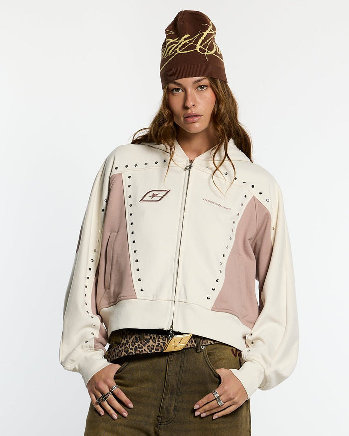 STUD ZIP HOODIE LIGHT GREY - cream and pink studded zip-up hoodie, front view on female model - Cold Culture #woman