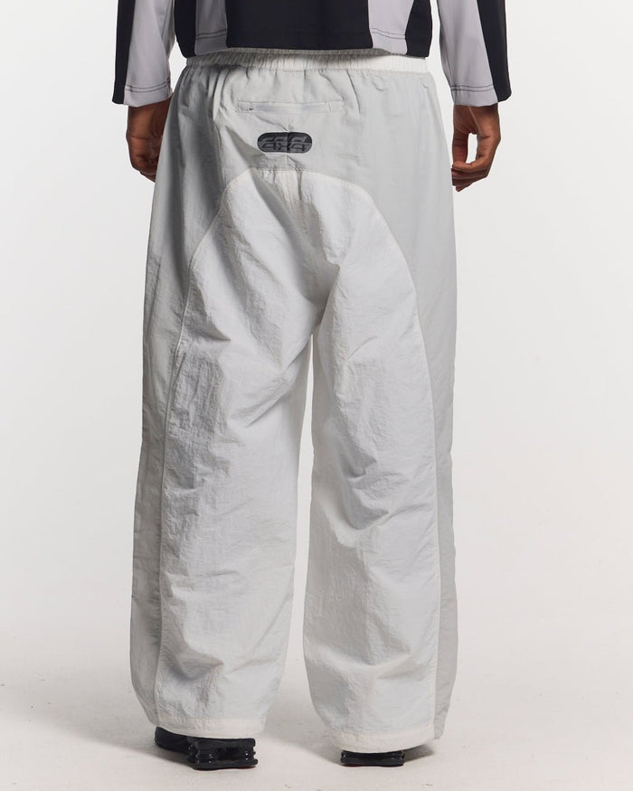 THUNDER PANTS LIGHT GREY - light grey nylon pants, back view on male model - Cold Culture #man