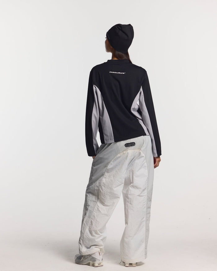 THUNDER PANTS LIGHT GREY - light grey nylon pants, back view on female model - Cold Culture #woman