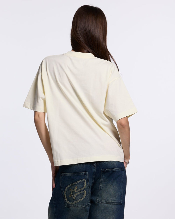 URBAN LEGACY TEE CREAM - cream graphic print tee, back view on female model - Cold Culture #woman