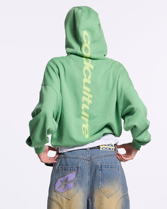 VERTICAL HOODIE GREEN - green vertical logo hoodie, back view on female model - Cold Culture #woman