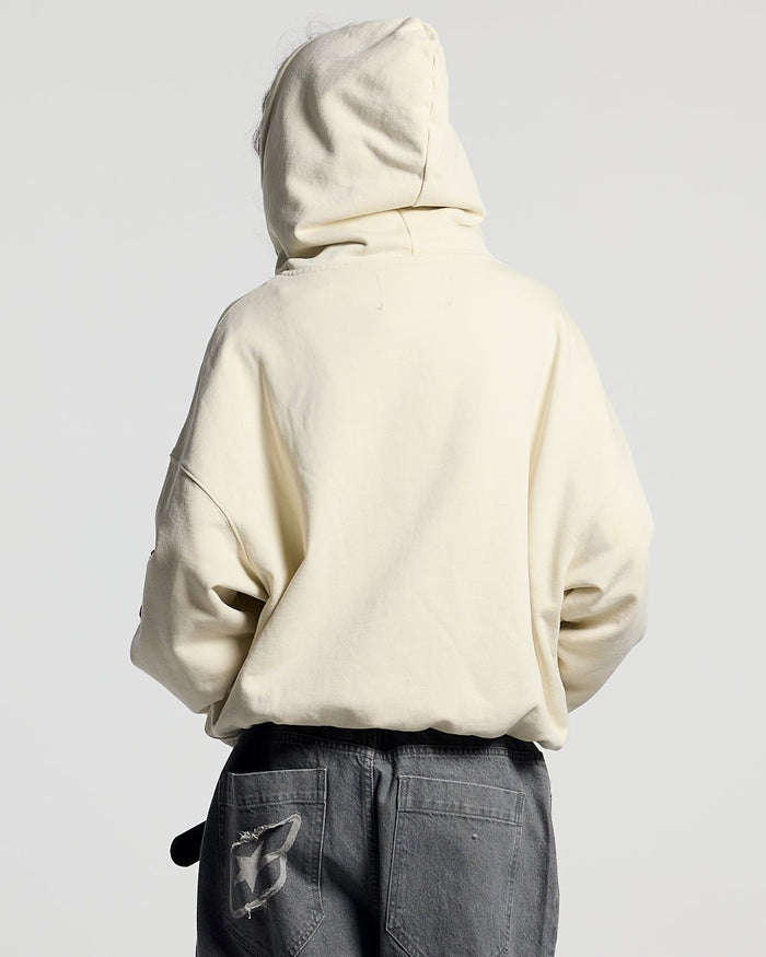WALKER ZIP HOODIE LIGHT GREY - cream zip-up hoodie with patches, back view on female model - Cold Culture #woman