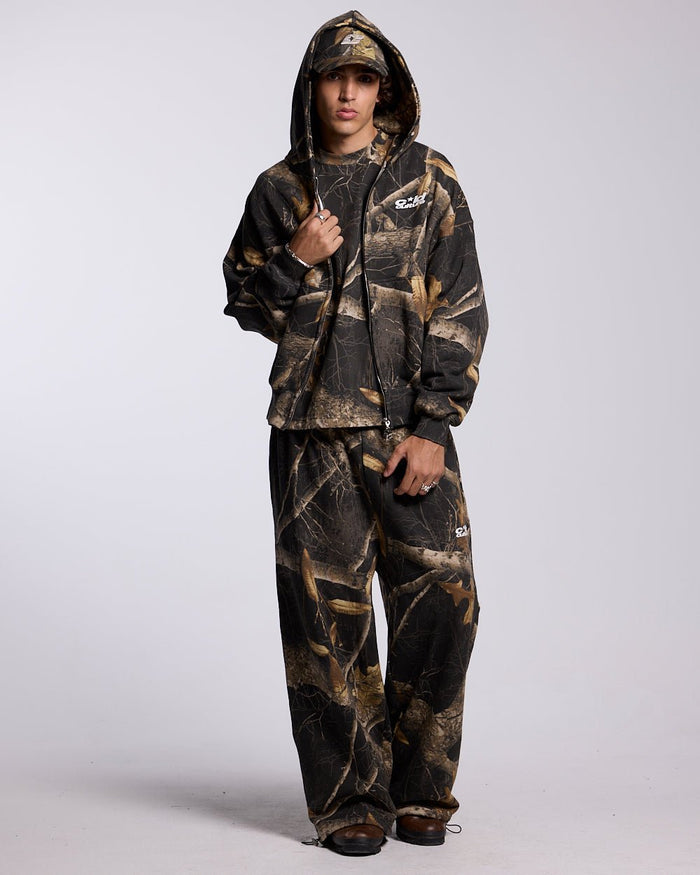 ZIP HOODIE REALTREE BLACK - black camo zip-up hoodie, front view on male model - Cold Culture #man